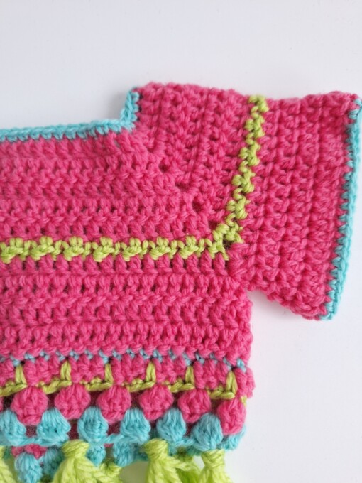 Gehaakt baby vestje | Roze, turquoise en groen met groene franjes